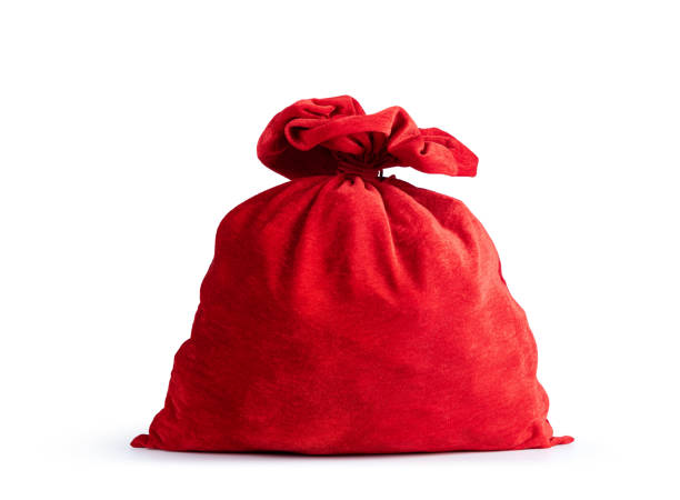 czerwona torba świętego mikołaja pełna prezentu, odizolowana na białym tle. plik zawiera ścieżkę do izolacji. - santa bag zdjęcia i obrazy z banku zdjęć