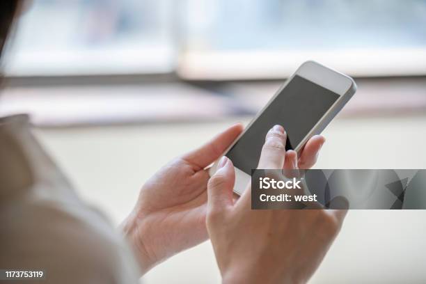 Hands Of A Woman Who Operates A Smartphone Stock Photo - Download Image Now - Smart Phone, Women, Accessibility