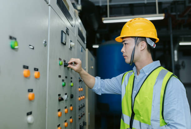 istock Asian male maintenance engineer working at energy control room. Engineering and business concept. 1173754342