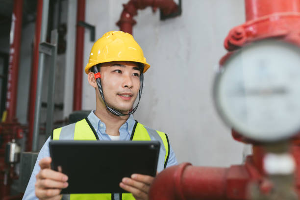istock Asian male maintenance engineer working with digital tablet. Engineering and business concept. 1173754451