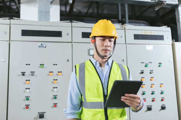 istock Asian male maintenance engineer working at energy control room. Engineering and business concept. 1173754462