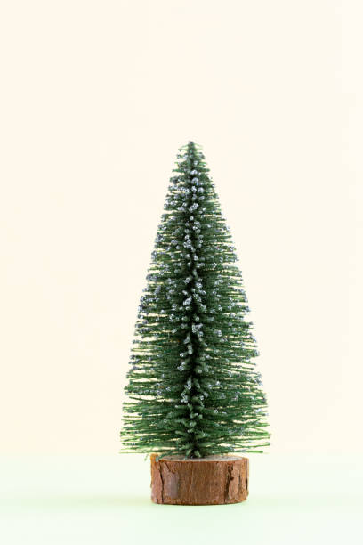 istock Christmas tree on pastel colored background. Christmas or New Year minimal concept. 1173756724