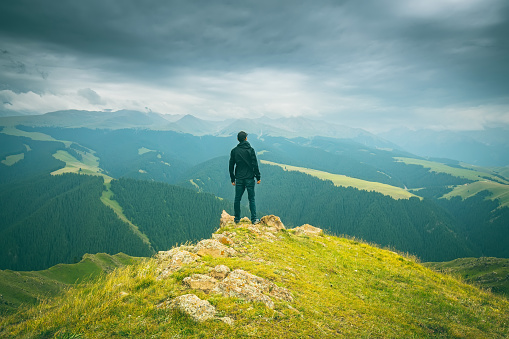 Man standing on top of mountain