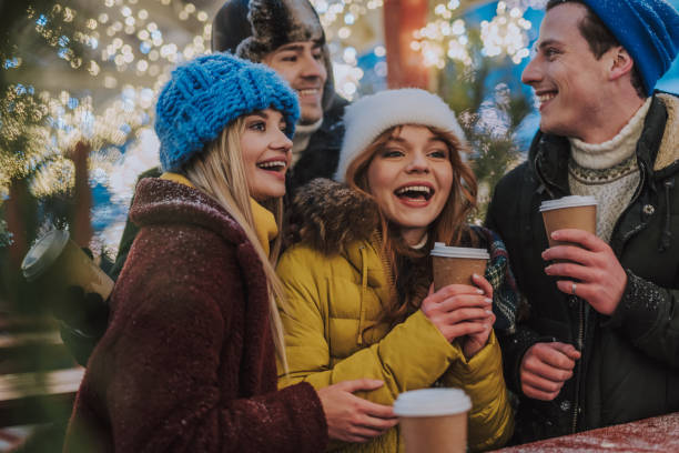 istock Positive delighted best friends drinking hot beverages 1173767231