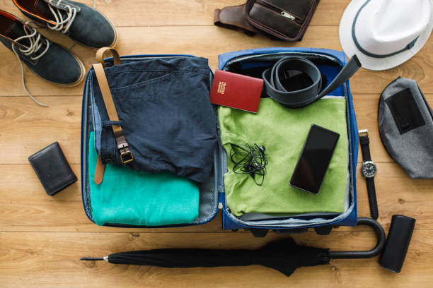 istock Flat lay of suitcase packed with clothes and personal possessions 1173768388