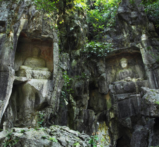 istock Buddhist statues carved in the rock 1173771043