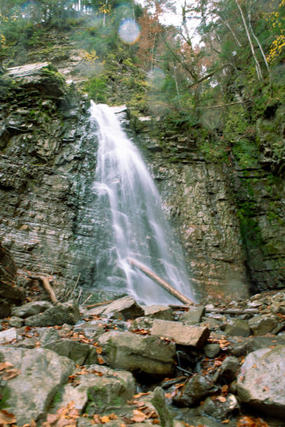 istock waterfall in autumn season 1173771880