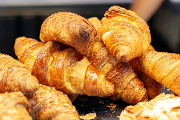 istock a group of croissants stacked on a tray. 1173775468