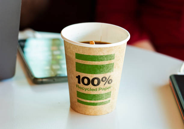 a recycled paper container containing hot coffee for a break. a recycled paper container containing hot coffee for a break. Environmental protection and ecological issues biodegradable photos stock pictures, royalty-free photos & images