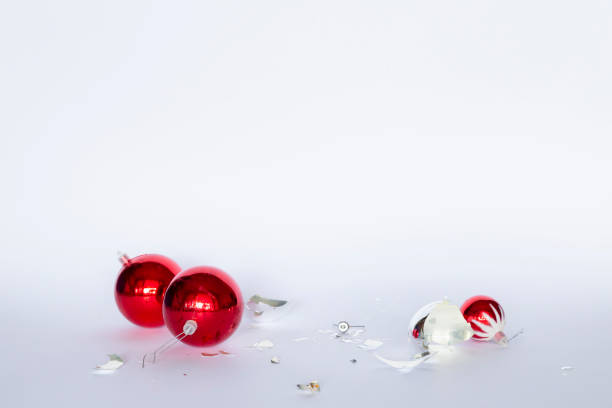 istock Shattered red and silver colored Christmas baubles 1173776669