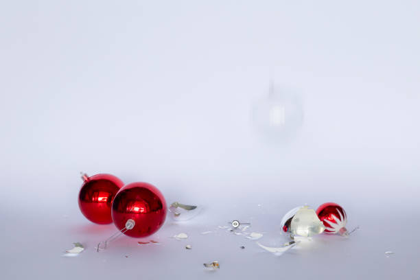 istock Shattered red and silver colored Christmas baubles 1173776745
