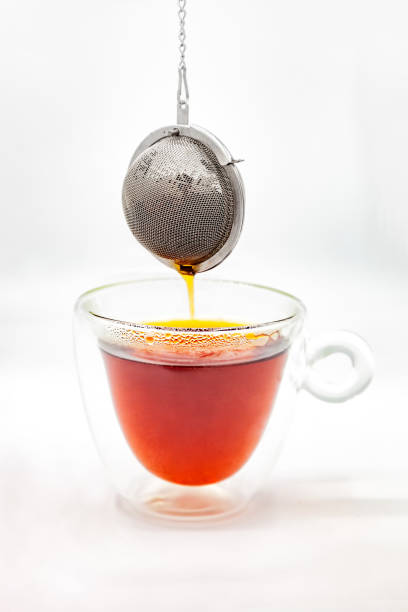 istock Tea strainer over boiled water in a glass cup 1173776898