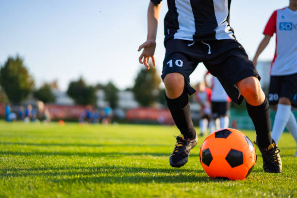 istock detail young professional soccer player with ball 1173777363