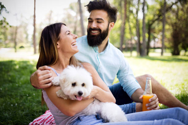 istock Happy young couple enjoying picnic in park. 1173780220