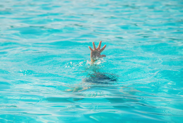 istock kid is drowning in the sea. Selective focus. 1173780585