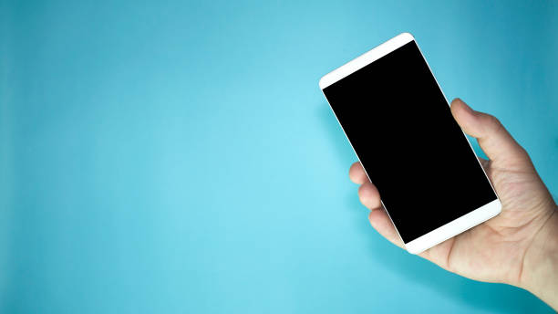 istock person holding smart mobile phone in hands and blue background 1173781284