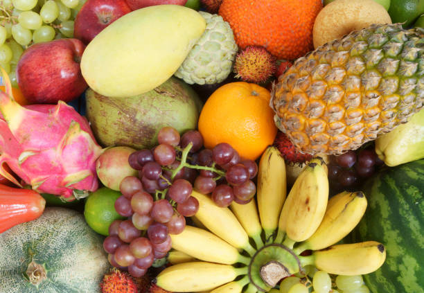 istock Tropical fruits background 1173782782