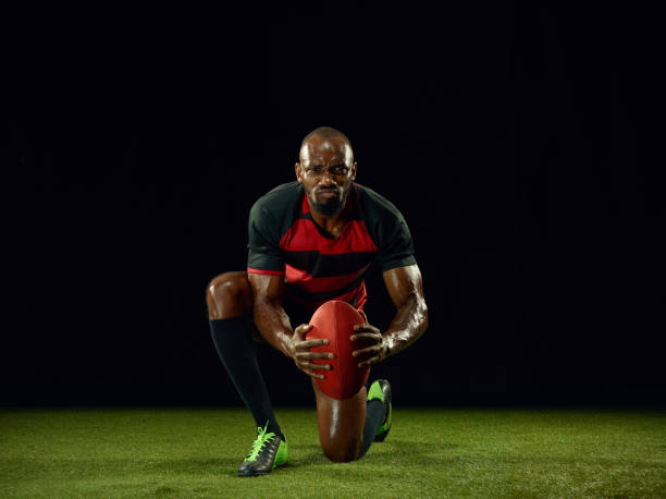 istock One african-american man playing rugby on black background 1173782801
