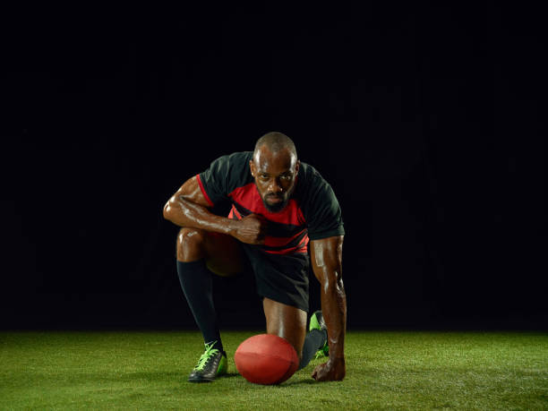 istock One african-american man playing rugby on black background 1173782827