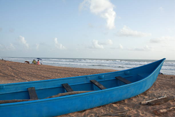istock Small fishing canoe on Candolim beach 1173783076
