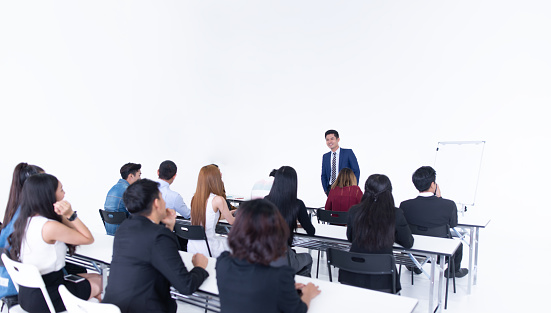 businessman presentation in a conference meeting room and audience of the lecturer