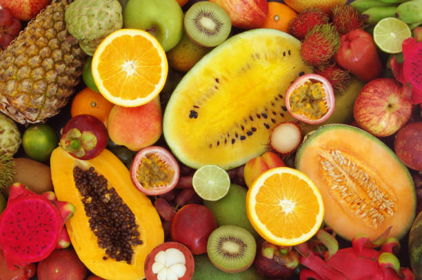 istock Assortment of tropical fruits as background 1173784335