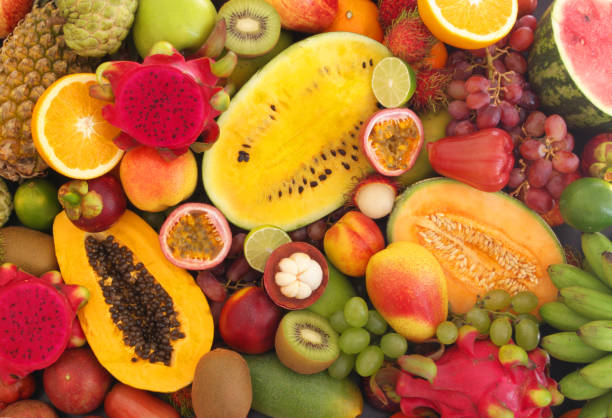 istock Assortment of tropical fruits as background 1173784343