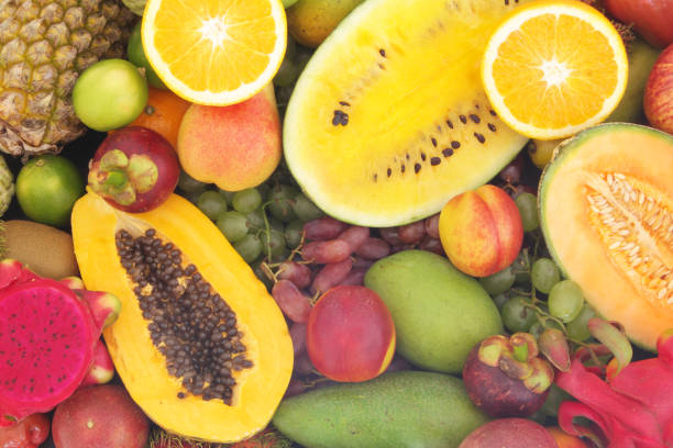 istock Assortment of tropical fruits as background 1173784391