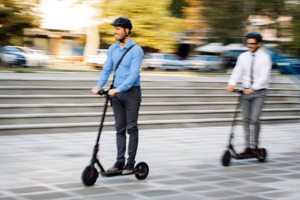 istock Businessmen riding electric scooter 1173786016