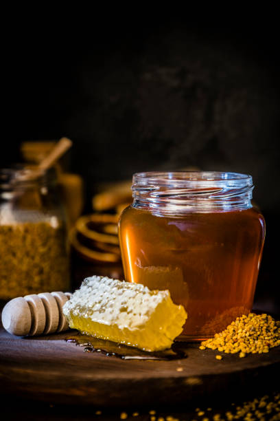 istock Honey jar, honeycomb and bee pollen 1173786175
