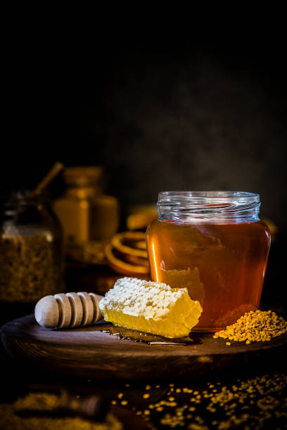 istock Honey jar, honeycomb and bee pollen 1173786222