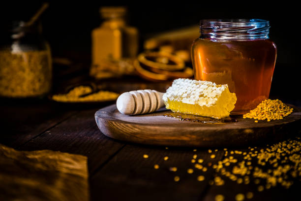 istock Honey jar, honeycomb and bee pollen 1173786233