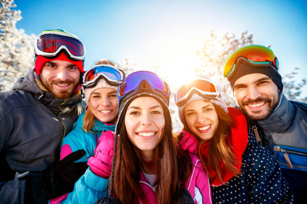 istock friends having fun on ski holiday in mountains 1173788315