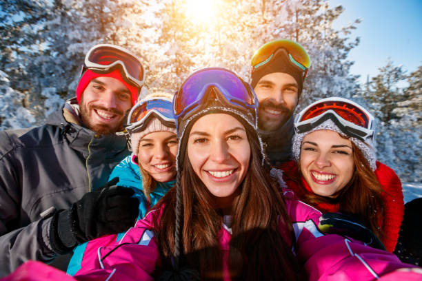 istock friends having fun on ski holiday in mountains 1173788463