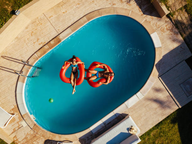 istock Couple relaxing in a swimming pool 1173788561