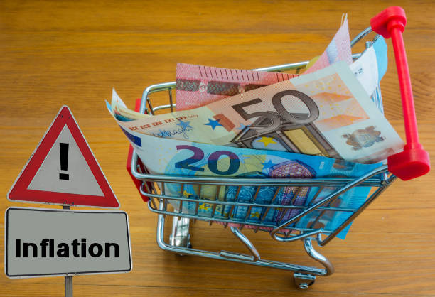 Sign Inflation Shopping Cart with Euro Banknotes stock photo