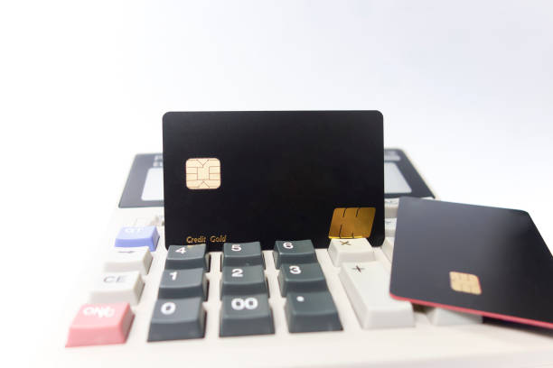 istock The calculator keyboard has a black bank card 1173801015