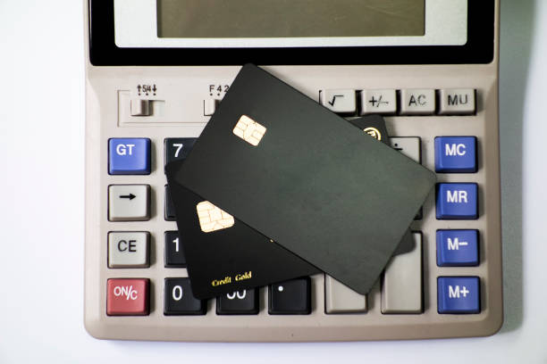 istock The calculator keyboard has a black bank card 1173801109