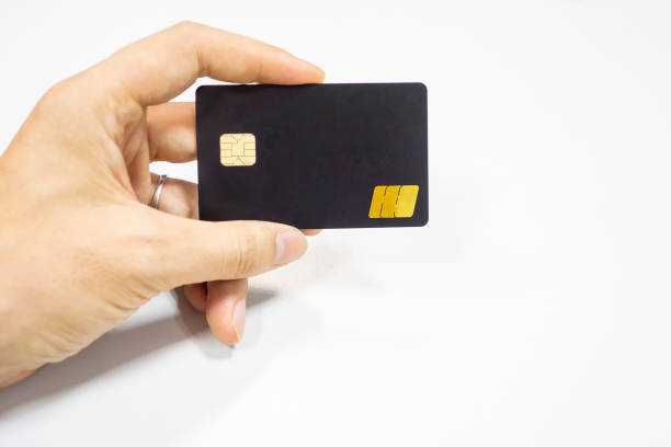 istock A black bank card in one hand in a white background 1173801147