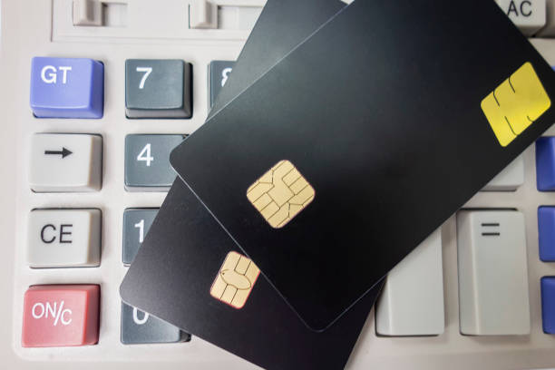 istock The calculator keyboard has a black bank card 1173801234