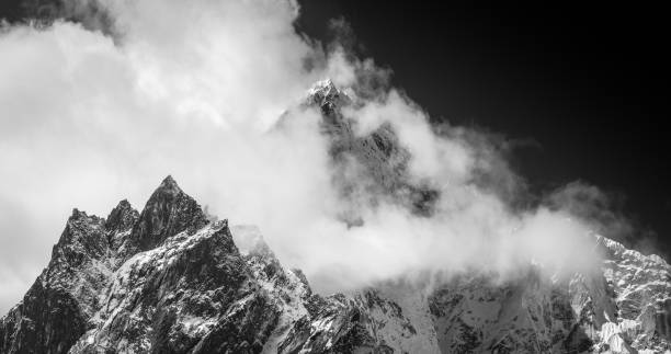 istock Monochrome mountains mist swirling through jagged peaks Himalaya panorama Nepal 1173801321