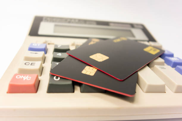 istock The calculator keyboard has a black bank card 1173801324