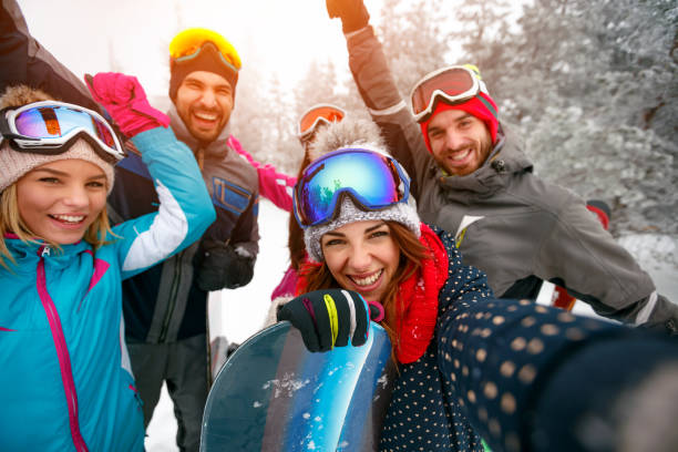 istock friends having fun on ski holiday in mountains 1173802111