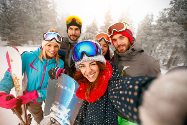 istock friends having fun on ski holiday in mountains 1173802803