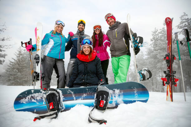istock friends having fun on ski holiday in mountains 1173803109