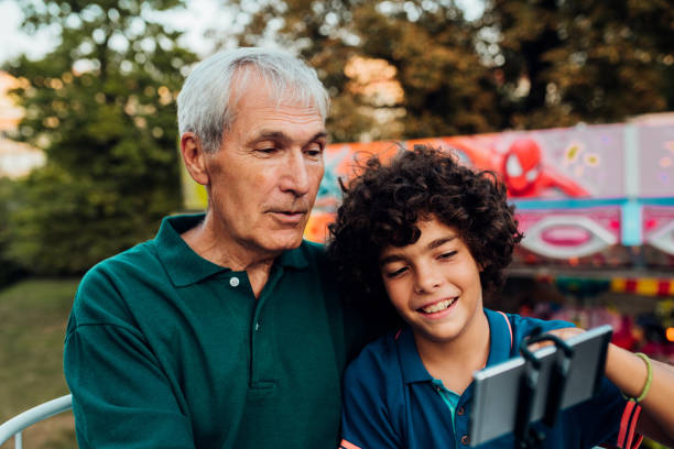 istock Grandson taking a photo with a selfie stick 1173803574