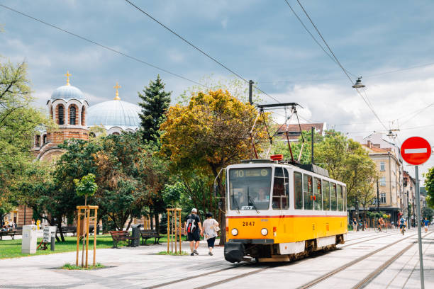 Graf Ignatiev street, Church of Sveti Sedmochislenitsi and old tram in Sofia, Bulgaria stock photo