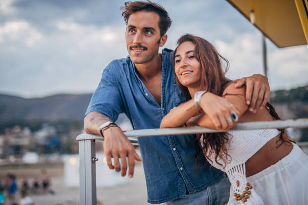istock Couple on lifeguard hut 1173806611
