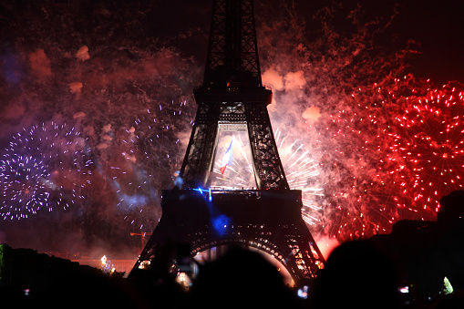 Famous fireworks near Eiffel Tower during celebrations of french national holiday, Bastille Day