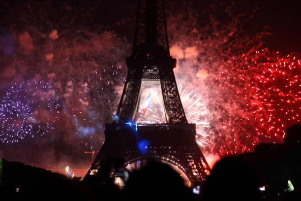 Paris fireworks Famous fireworks near Eiffel Tower during celebrations of french national holiday, Bastille Day bastille day photos stock pictures, royalty-free photos & images